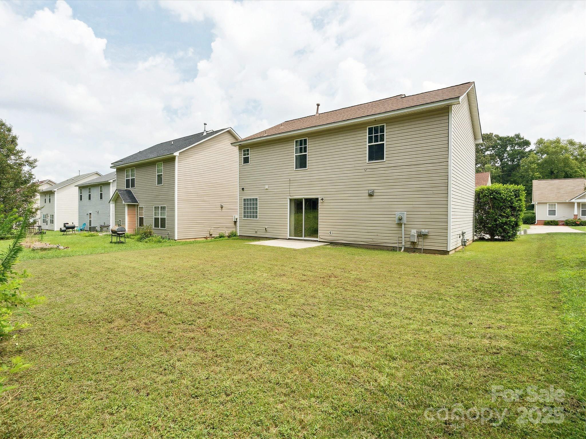 829 Raindrops Road Gastonia, NC 28054 - Photo 14 of 16 a view of a house with backyard of house