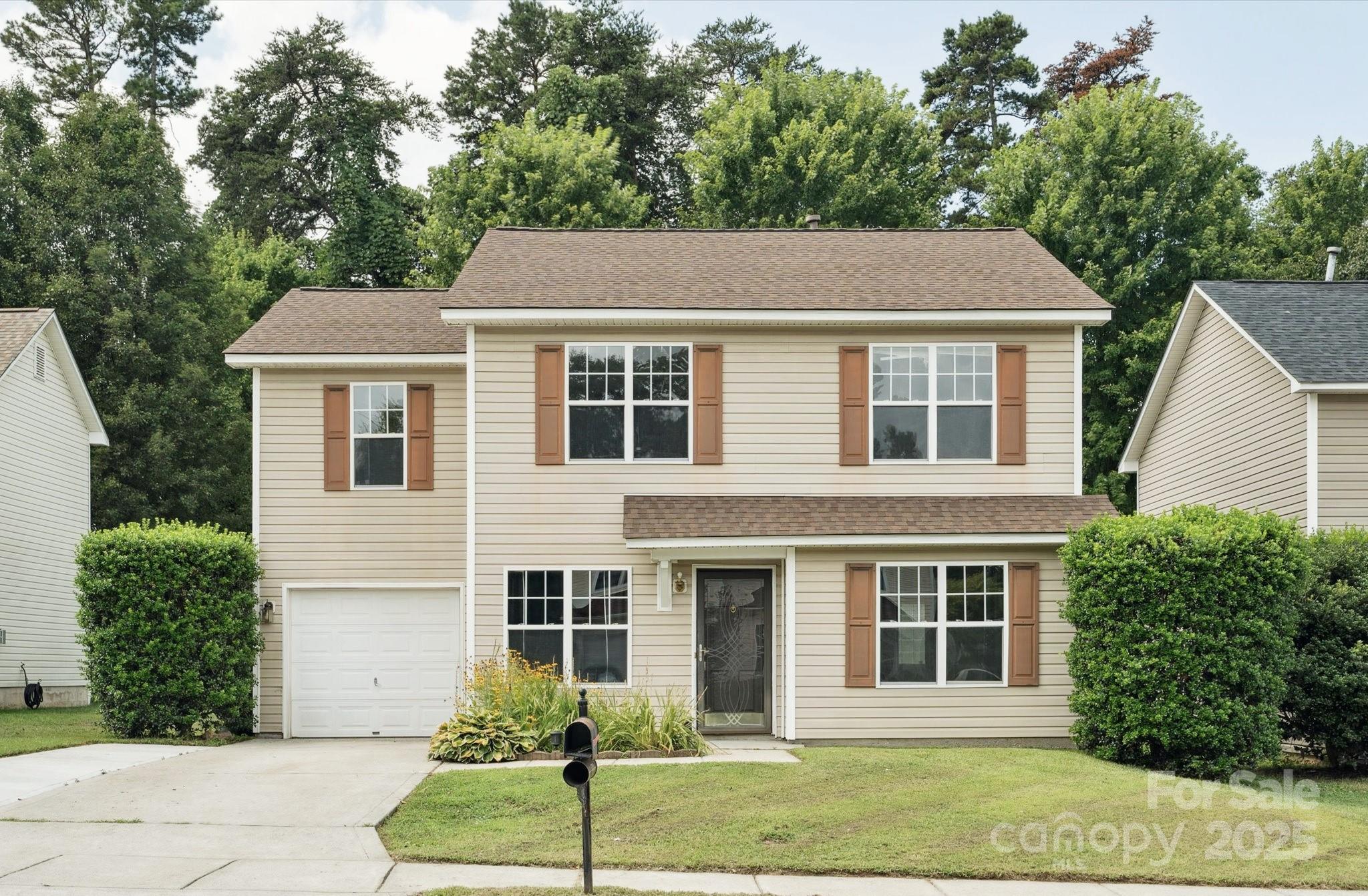 829 Raindrops Road Gastonia, NC 28054 - Photo 15 of 16 a front view of a house with a yard