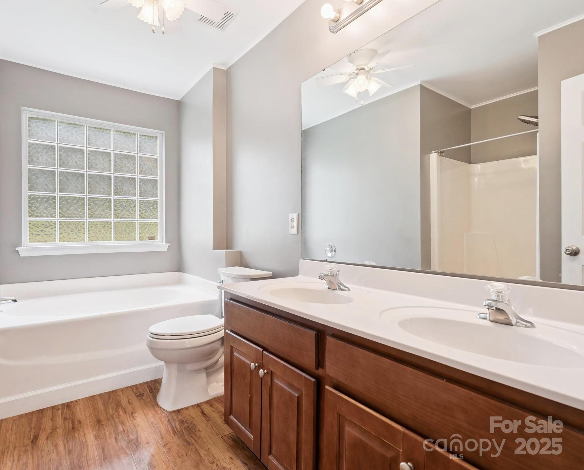 829 Raindrops Road Gastonia, NC 28054 - Photo 6 of 16 a bathroom with a granite countertop sink and a large mirror
