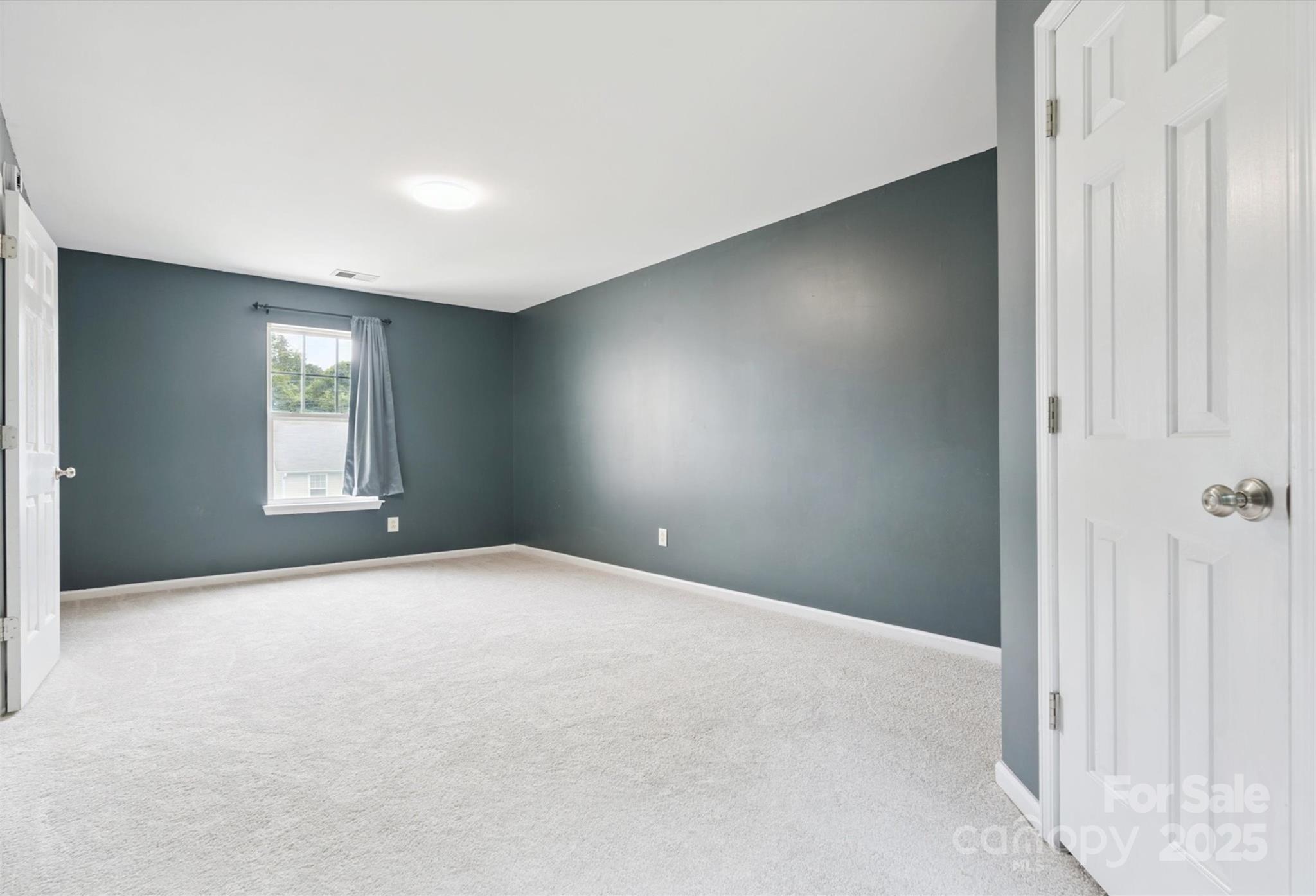 829 Raindrops Road Gastonia, NC 28054 - Photo 9 of 16 a view of an empty room and window