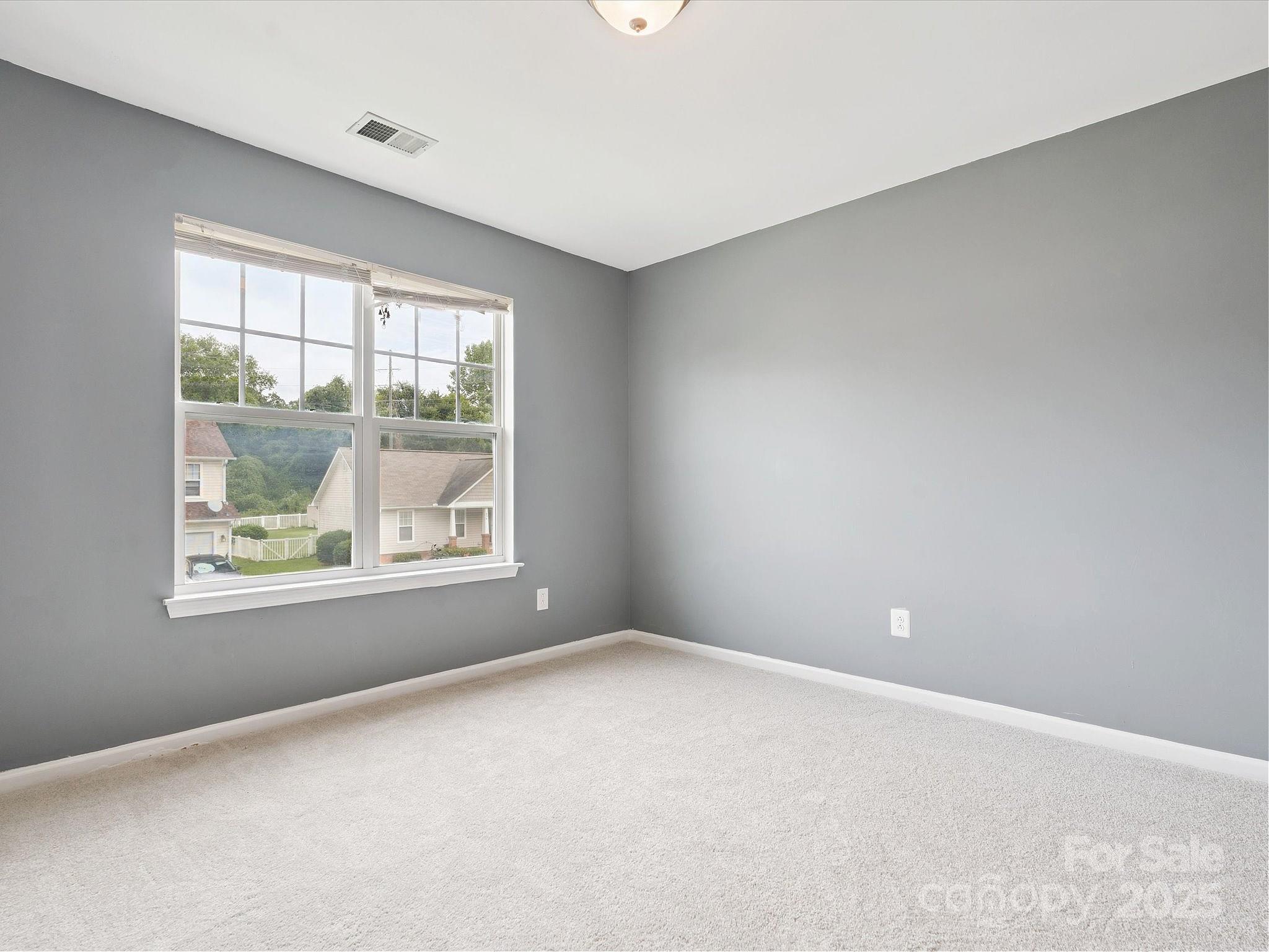 829 Raindrops Road Gastonia, NC 28054 - Photo 10 of 16 an empty room with windows