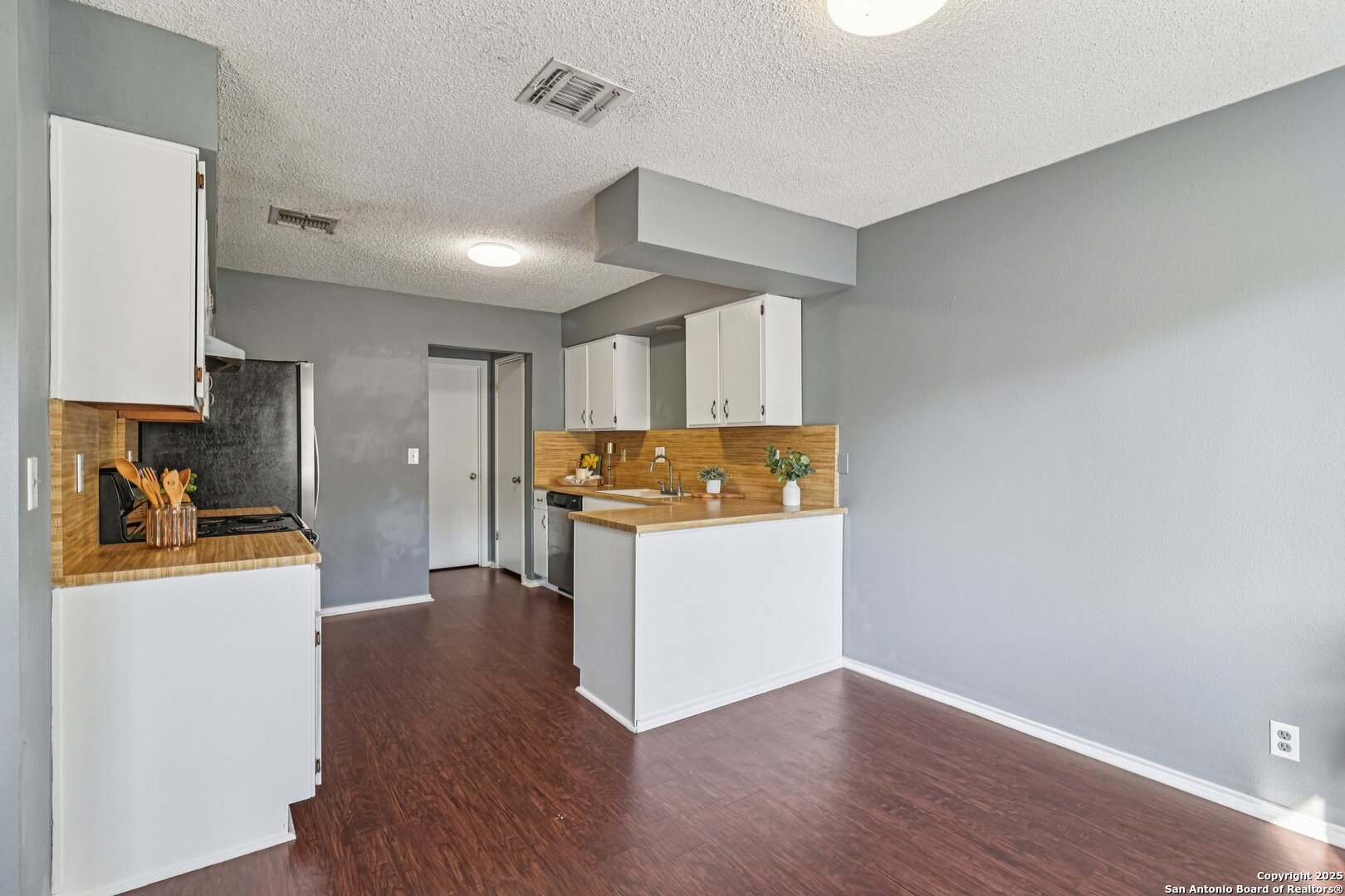 9334 Dover Ridge San Antonio, TX 78250 - Photo 17 of 39 a view of a kitchen with wooden floor