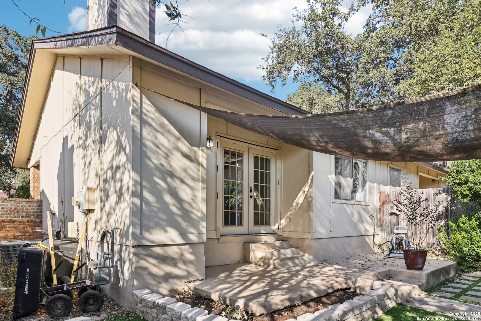 9334 Dover Ridge San Antonio, TX 78250 - Photo 35 of 39 a front view of a house with a yard