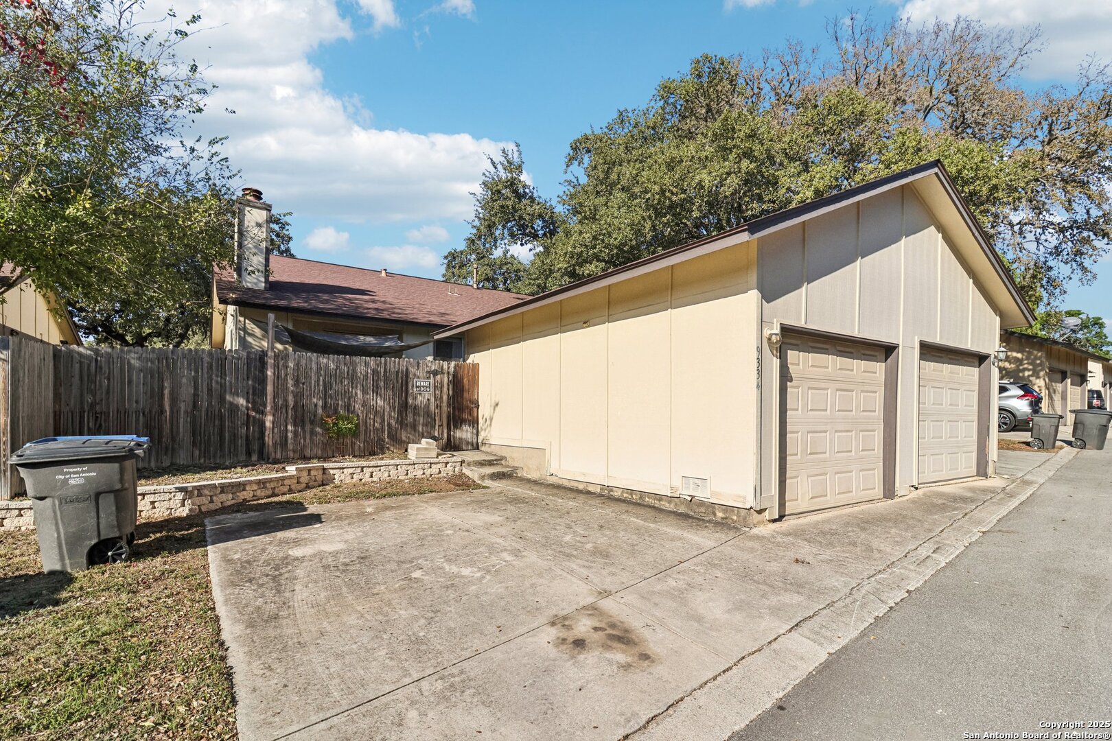 9334 Dover Ridge San Antonio, TX 78250 - Photo 37 of 39 a backyard of a house with table and chairs