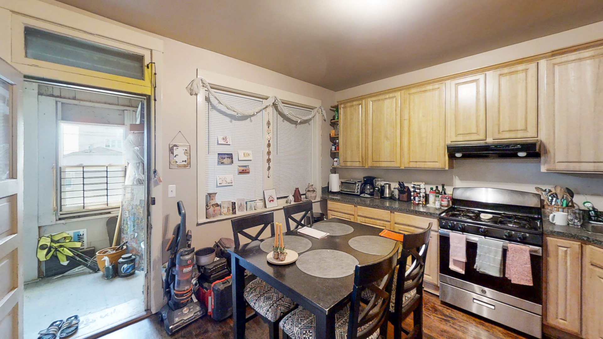 3237 West Cortez Street Chicago, IL 60651 - Photo 11 of 28 a kitchen with sink refrigerator dining table and chairs