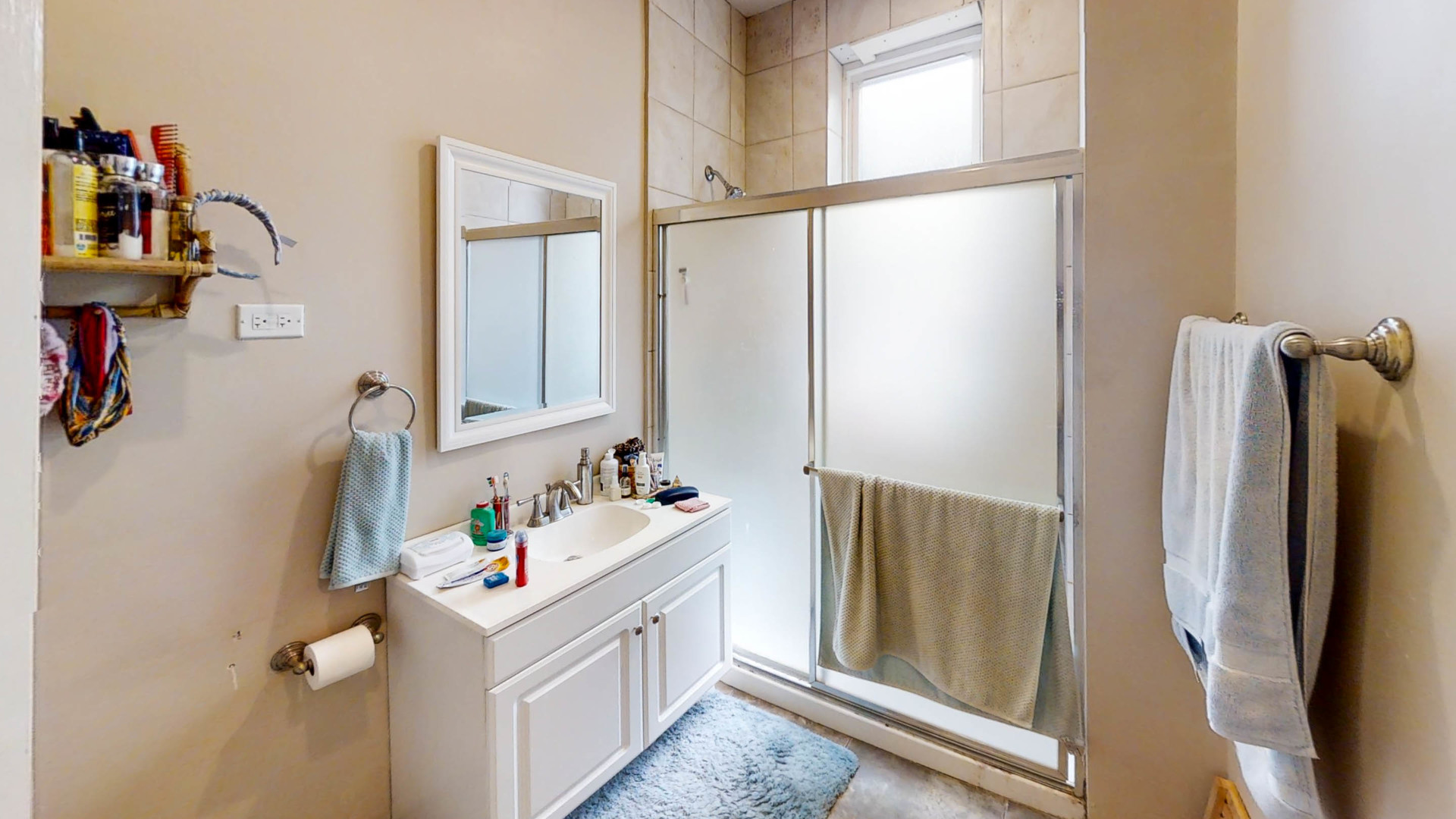 3237 West Cortez Street Chicago, IL 60651 - Photo 12 of 28 a bathroom with a sink and mirror with bathtub