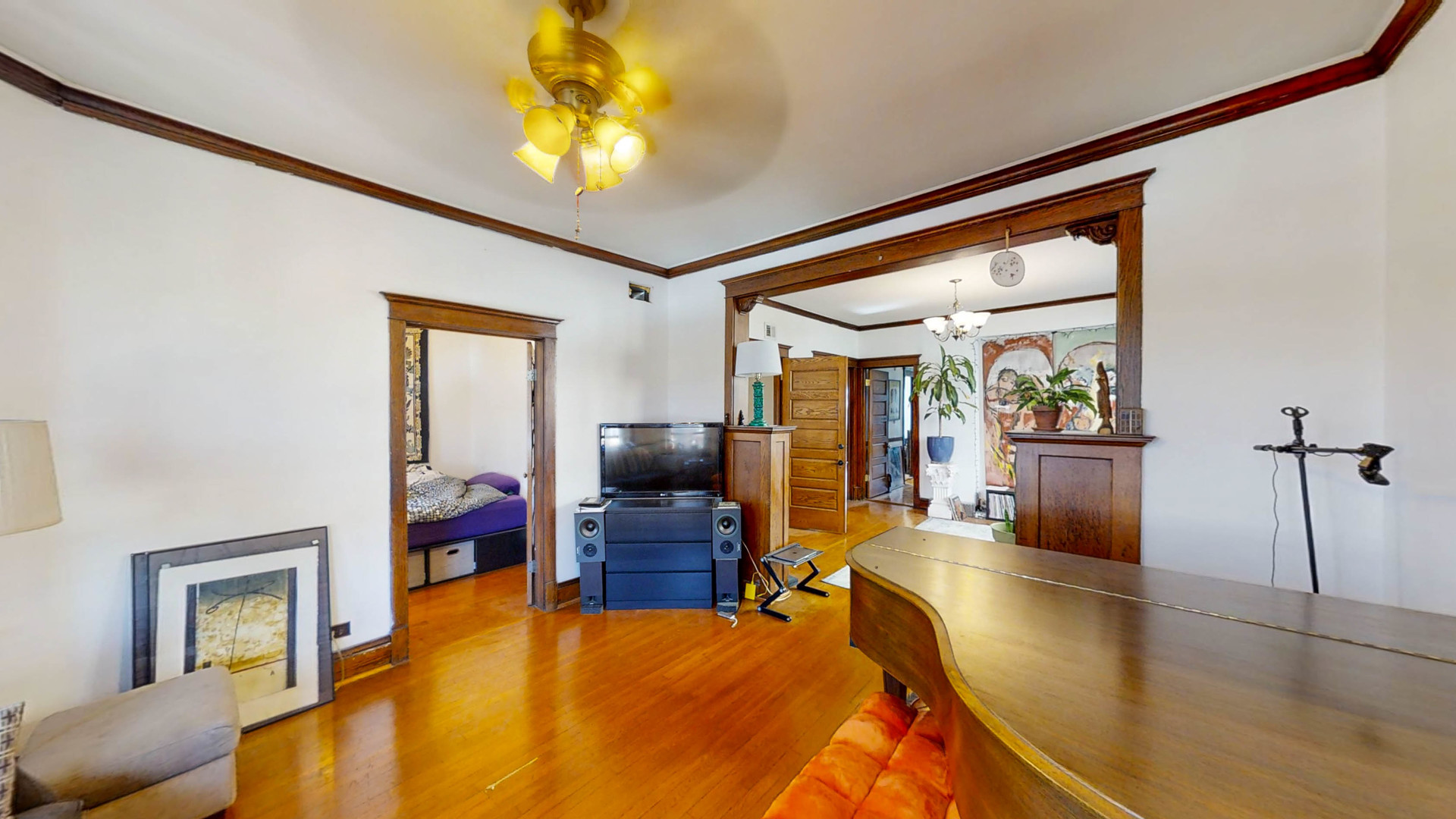 3237 West Cortez Street Chicago, IL 60651 - Photo 13 of 28 a bed room with a bed and a chandelier