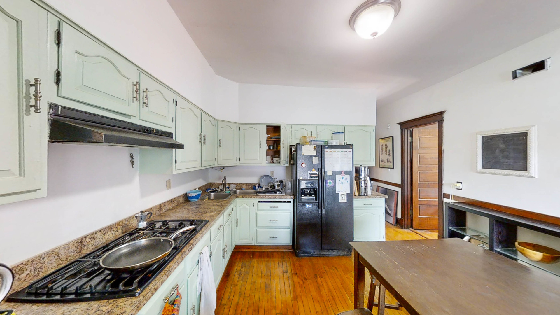 3237 West Cortez Street Chicago, IL 60651 - Photo 16 of 28 a kitchen with stainless steel appliances granite countertop a stove and a refrigerator