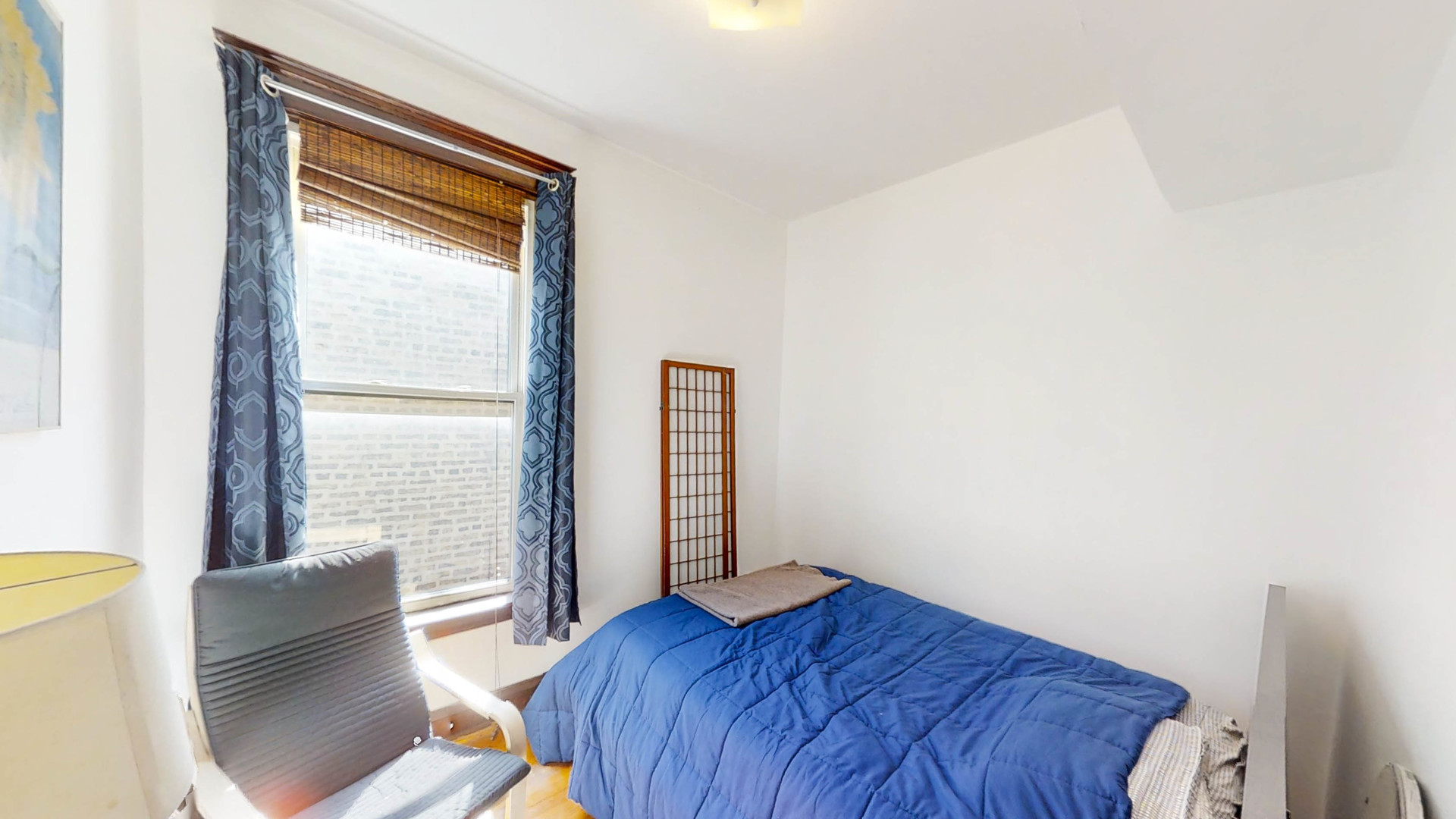 3237 West Cortez Street Chicago, IL 60651 - Photo 19 of 28 a bedroom with a bed and wooden floor