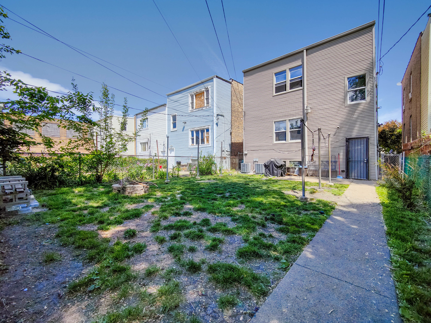 3237 West Cortez Street Chicago, IL 60651 - Photo 25 of 28 a front view of a house with plants and garden