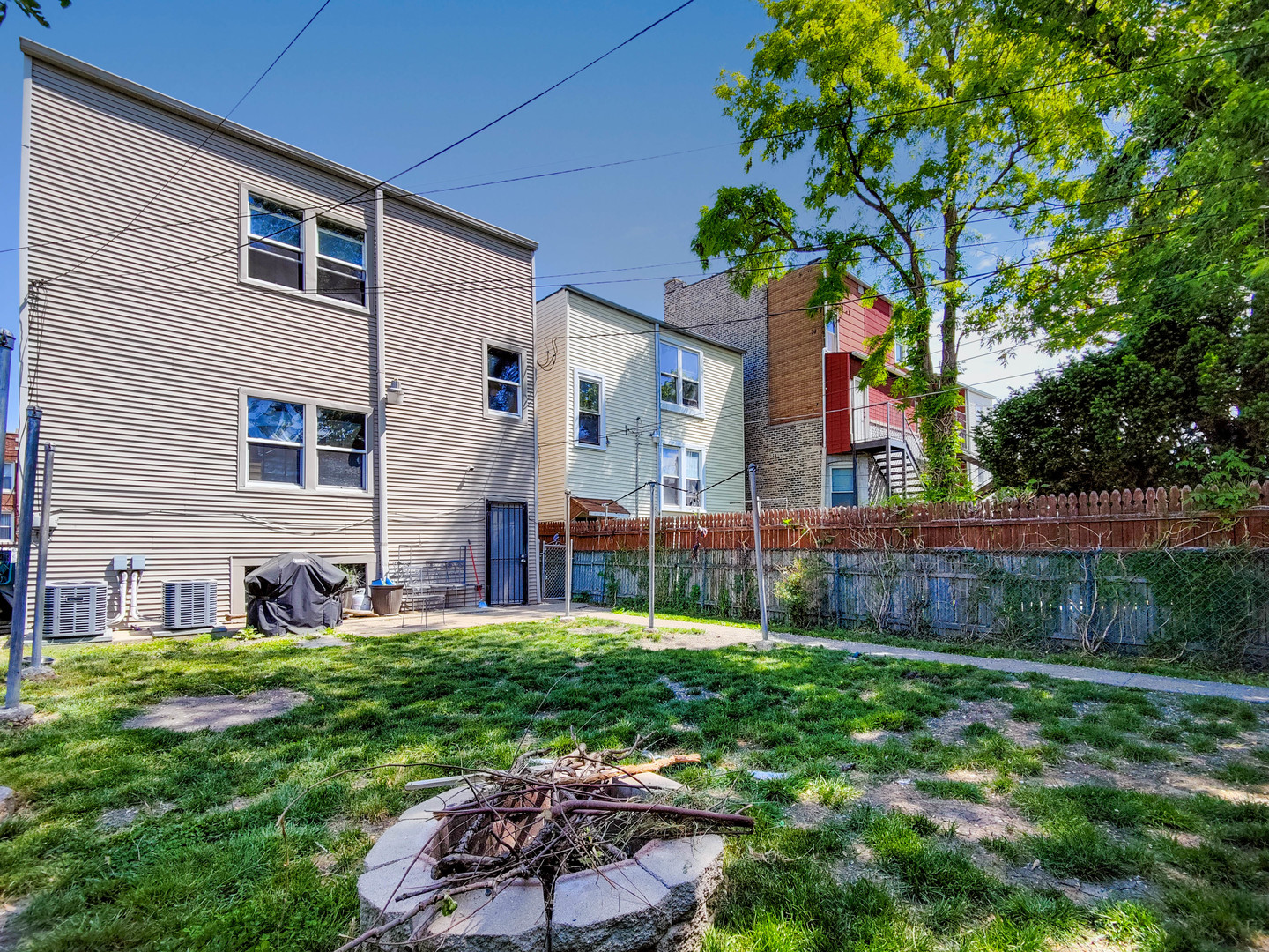 3237 West Cortez Street Chicago, IL 60651 - Photo 26 of 28 a house view with a sitting space and garden