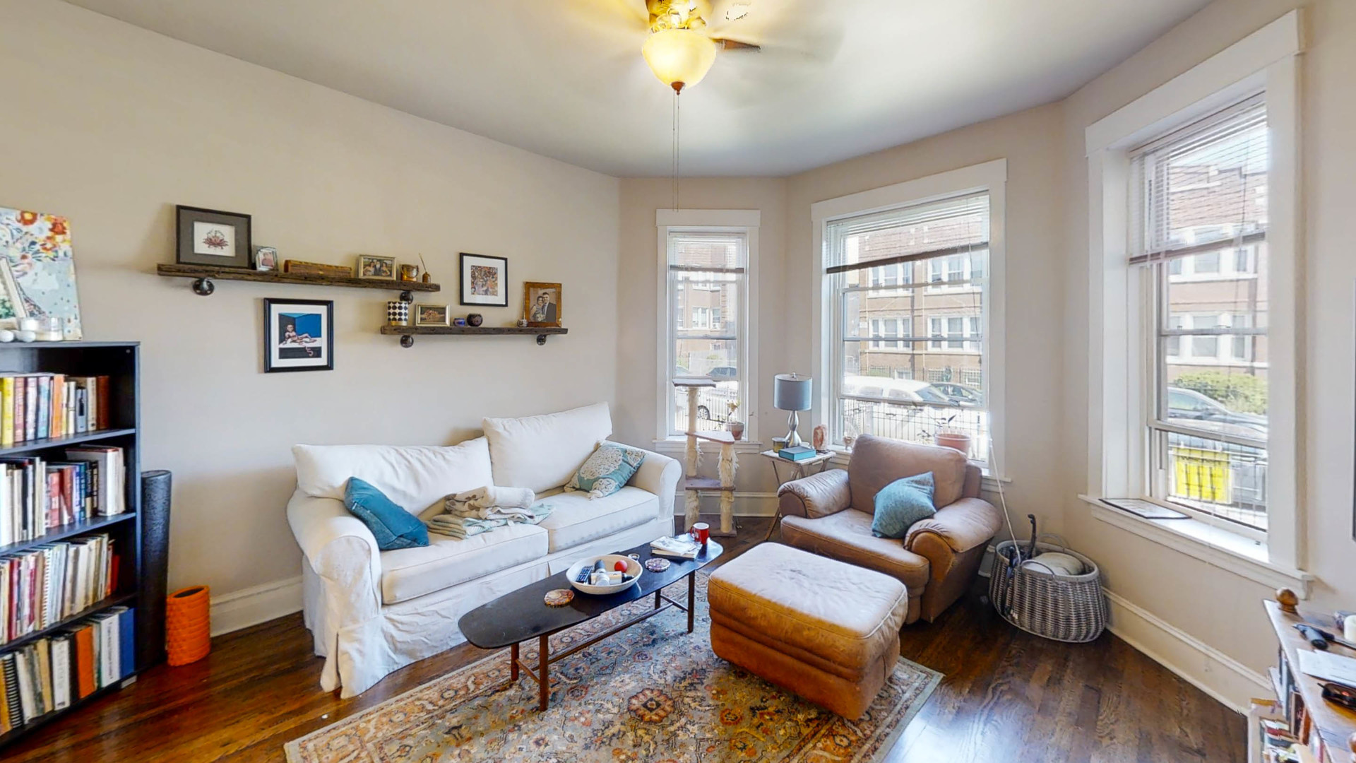 3237 West Cortez Street Chicago, IL 60651 - Photo 5 of 28 a living room with furniture and a book shelf