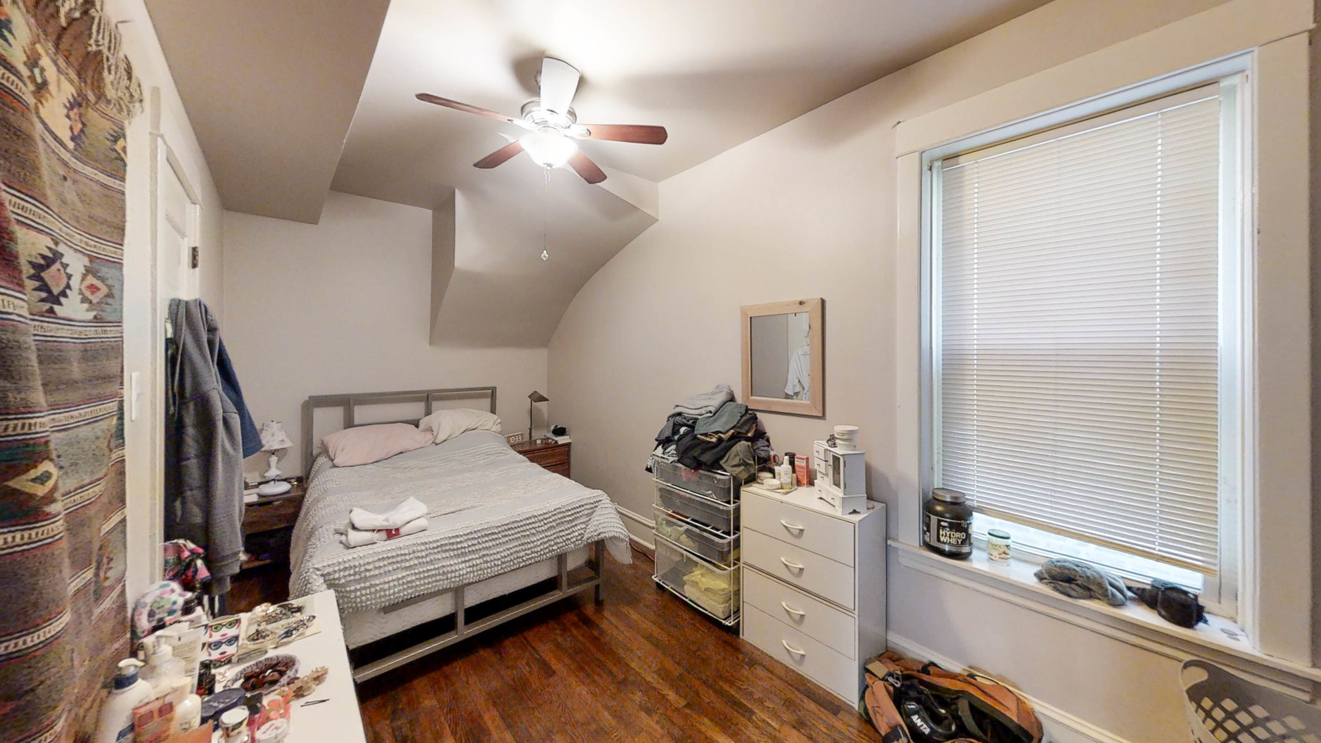 3237 West Cortez Street Chicago, IL 60651 - Photo 7 of 28 a bedroom with a bed and a large mirror with a hardwood