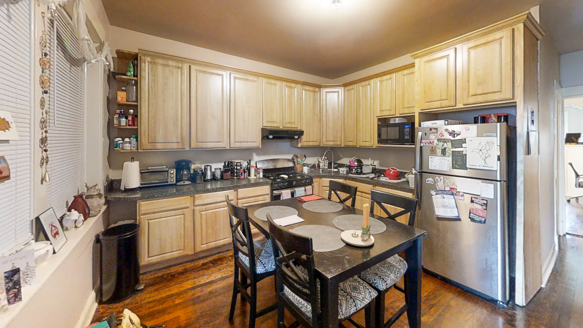 3237 West Cortez Street Chicago, IL 60651 - Photo 9 of 28 a kitchen with a refrigerator a stove a sink dishwasher and a refrigerator with wooden floor