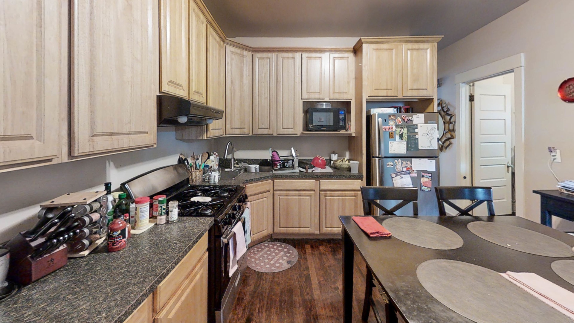 3237 West Cortez Street Chicago, IL 60651 - Photo 10 of 28 a kitchen with a table chairs stove and cabinets