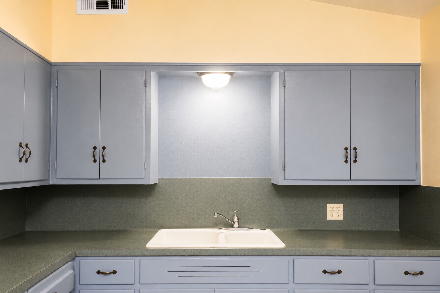 1508 Walnut Street Georgetown, TX 78626 - Photo 19 of 37 Functional kitchen with ample cabinet space and a practical double basin sink.