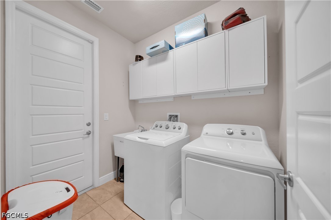 384 Neighborly Road LaBelle, FL 33935 - Photo 23 of 45 a view of bathroom with a washer and dryer