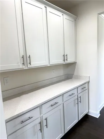 a view of cabinets and window