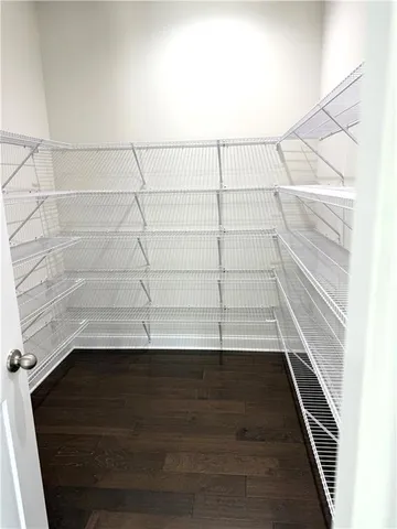 a view of an empty walk in closet