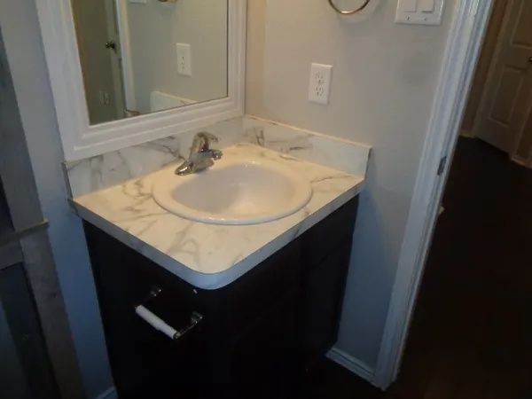 a bathroom with a sink and a mirror
