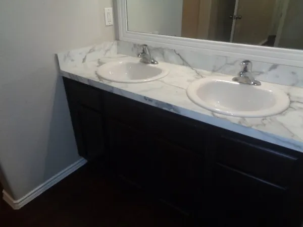 a bathroom with a sink and a mirror
