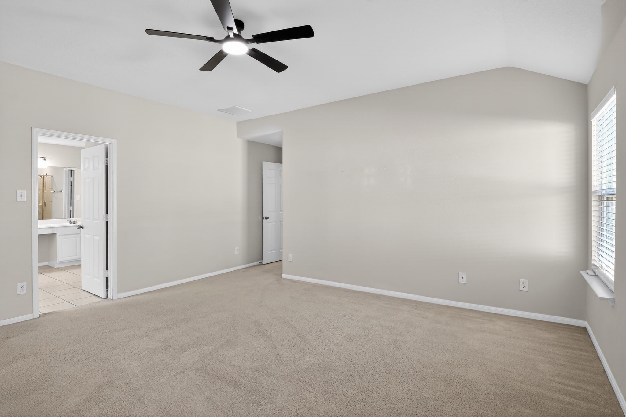 4938 Yearling Ridge Court Katy, TX 77449 - Photo 13 of 29 wooden floor in an empty room and a window