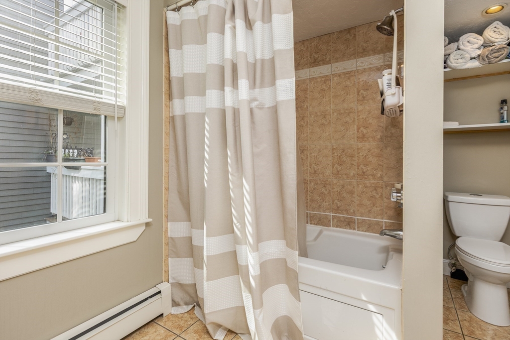 10 Andrew Street, Unit 2A Salem, MA 01970 - Photo 16 of 27 a bathroom with a toilet and a shower