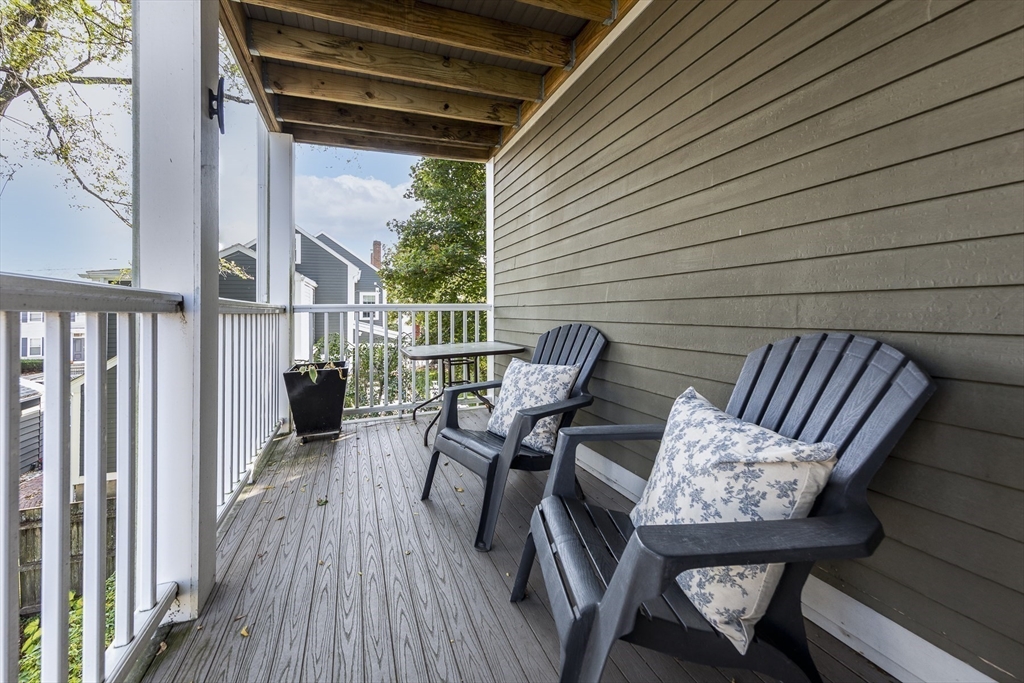 10 Andrew Street, Unit 2A Salem, MA 01970 - Photo 23 of 27 a view of balcony with wooden floor and outdoor seating
