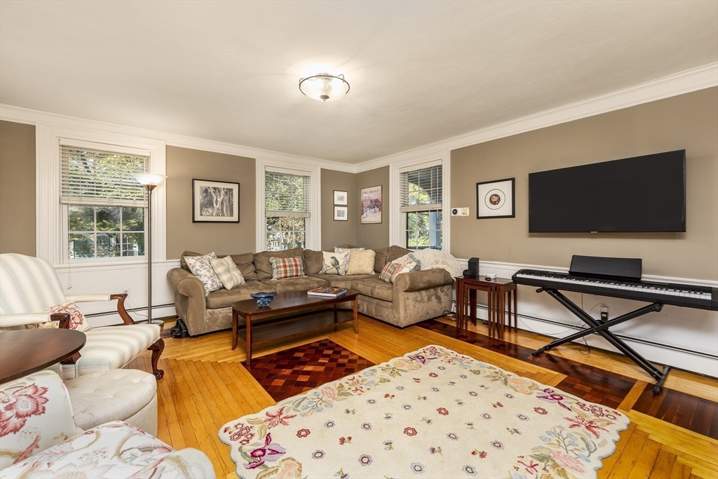 10 Andrew Street, Unit 2A Salem, MA 01970 - Photo 3 of 27 a living room with furniture and a flat screen tv