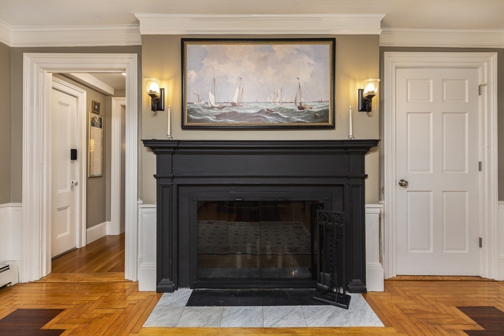 10 Andrew Street, Unit 2A Salem, MA 01970 - Photo 5 of 27 a living room with a fireplace and a wooden floor