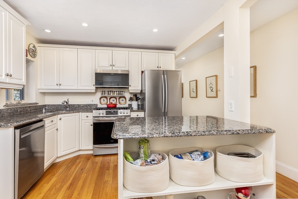 10 Andrew Street, Unit 2A Salem, MA 01970 - Photo 10 of 27 a large kitchen with stainless steel appliances granite countertop a granite counter tops and a sink