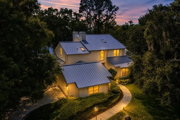 a aerial view of a house with garden space and street view