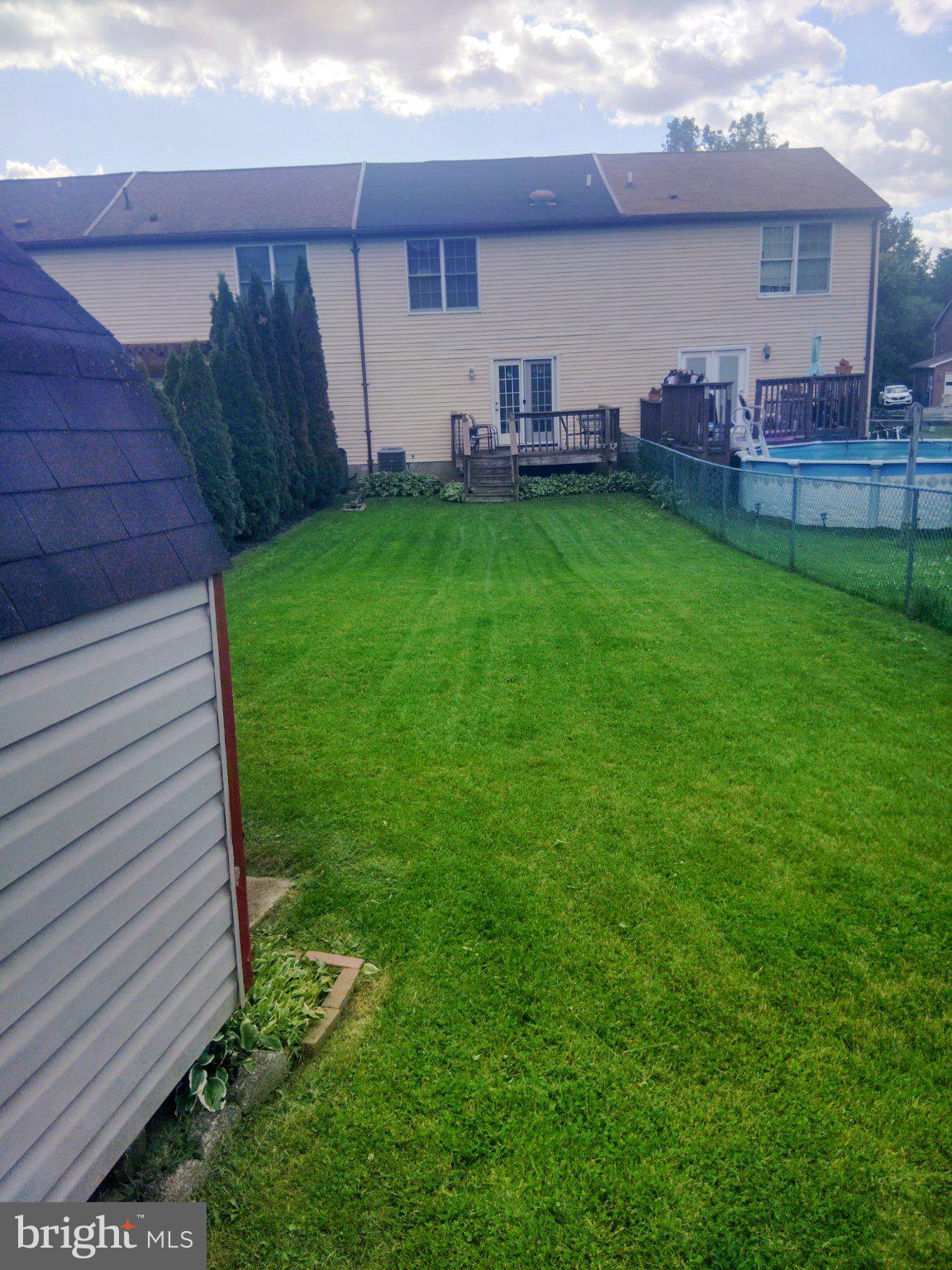 69 Johnson Smithsburg, MD 21783 - Photo 10 of 39 a backyard of a house with table and chairs a barbeque