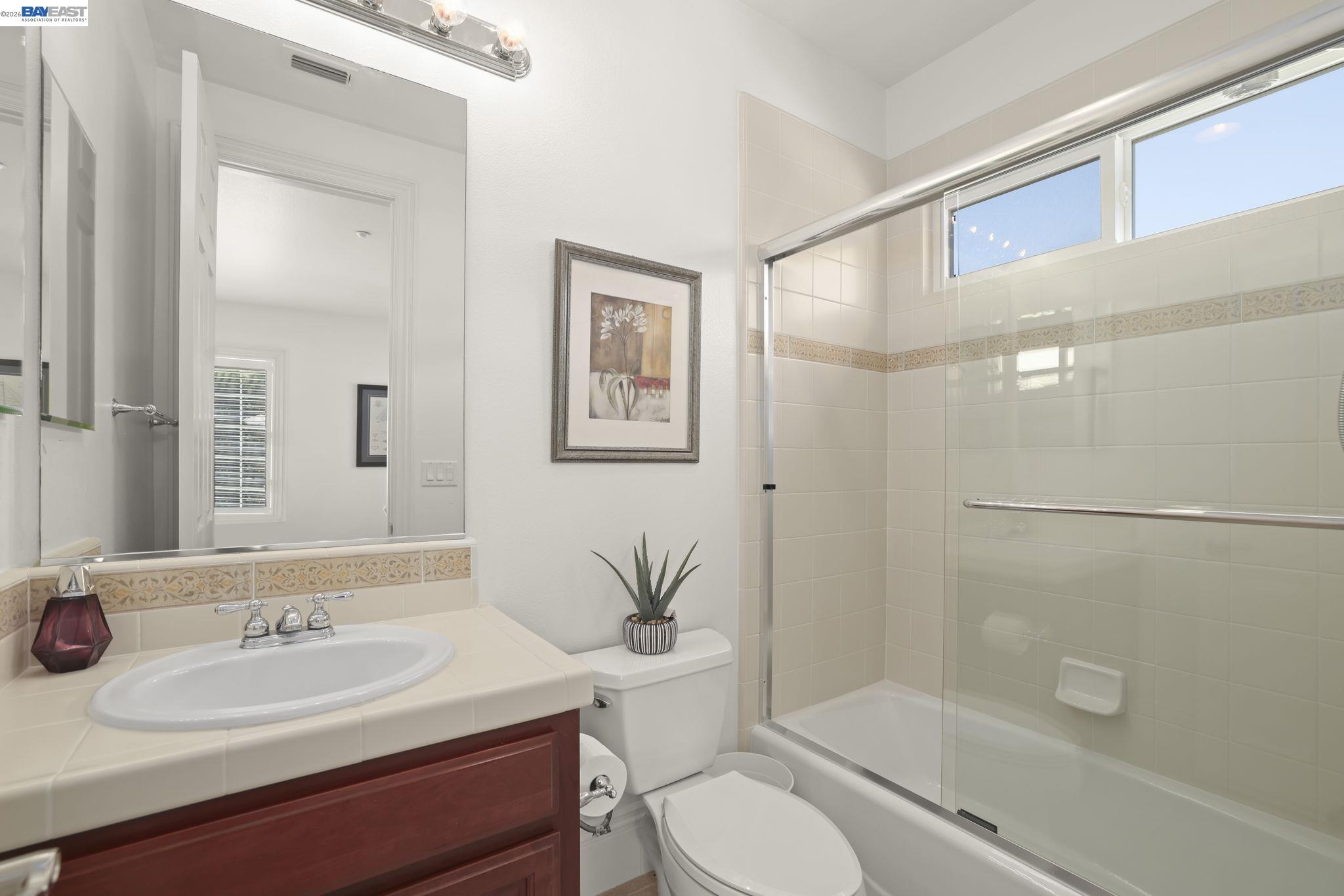 950 Winsford Court San Ramon, CA 94583 - Photo 54 of 68 a bathroom with a sink a toilet and shower