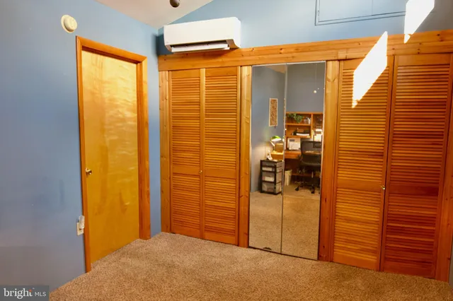 a bathroom with a granite countertop sink and a bathtub