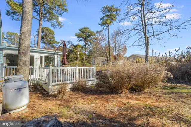 a view of front door and deck of the house