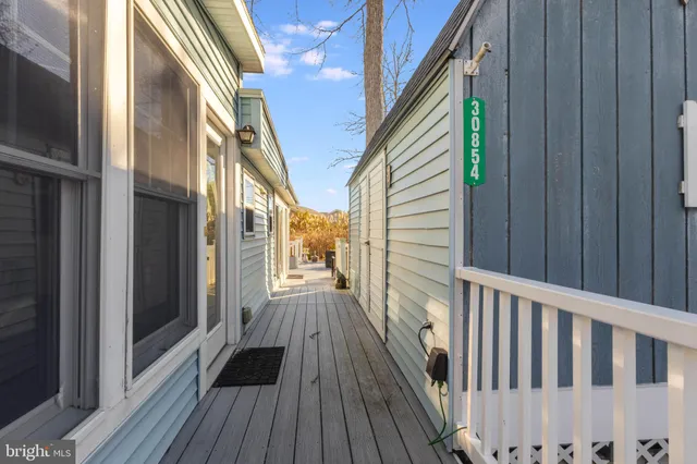 a view of a balcony with wooden floor