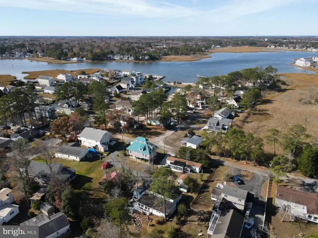a view of a lake with a house and a ocean view