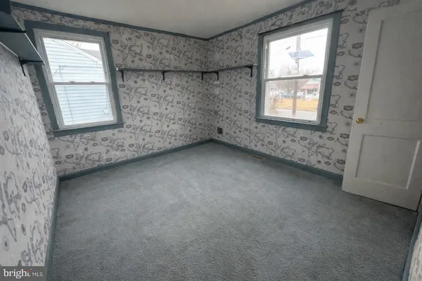 an empty room with windows