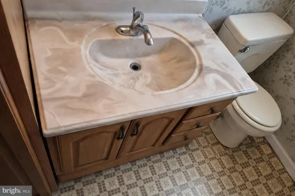 a bathroom with a toilet and a sink