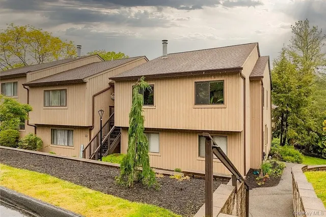 a house view with a swimming pool
