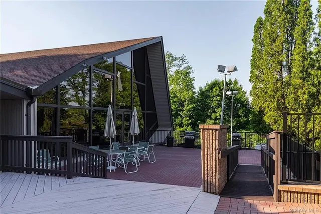 a view of a chairs and table in the patio
