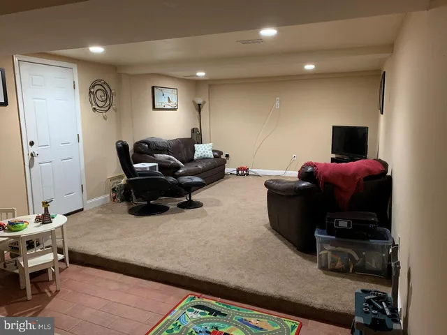 a living room with furniture and a couch