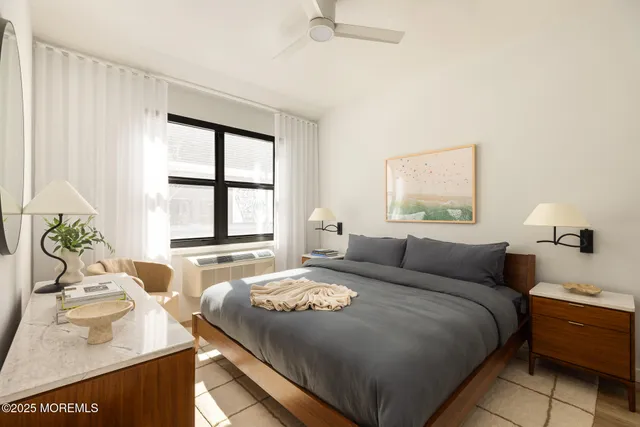 a bedroom with a bed and a window