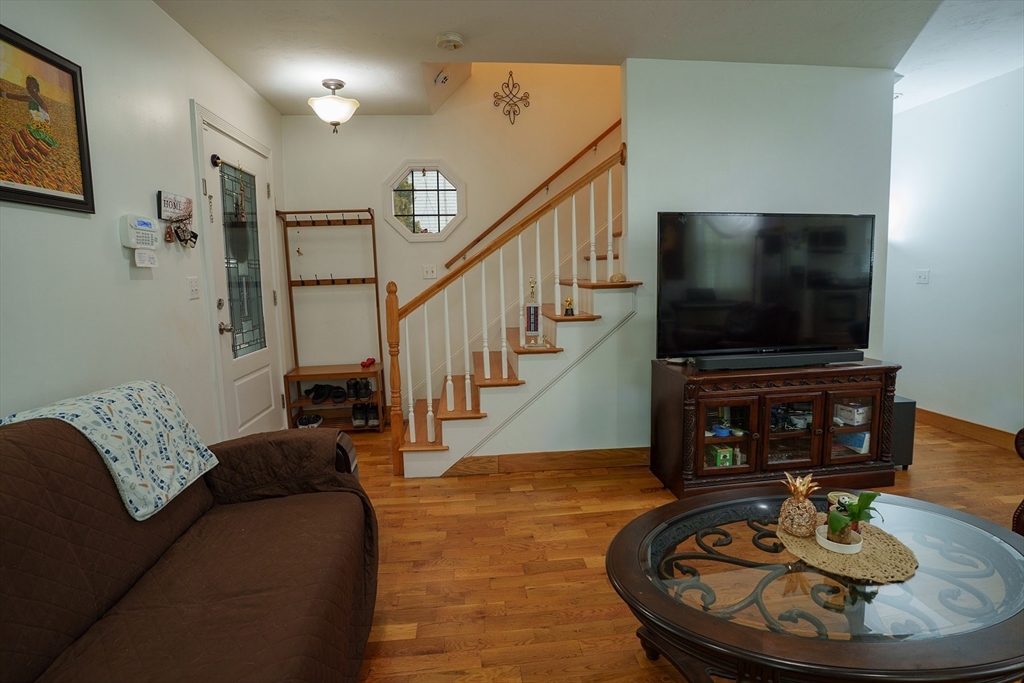 80 Collins Street Lynn, MA 01902 - Photo 14 of 25 a living room with furniture and a flat screen tv
