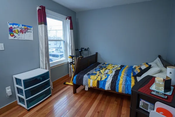a room with toys and a wooden floor