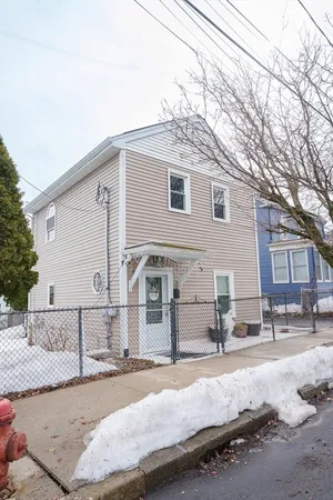 a view of a white house with a outdoor space