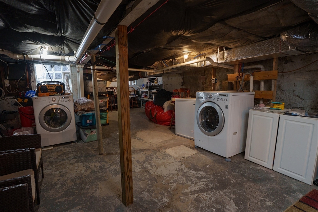 80 Collins Street Lynn, MA 01902 - Photo 21 of 25 a utility room with dryer washer and a view of kitchen