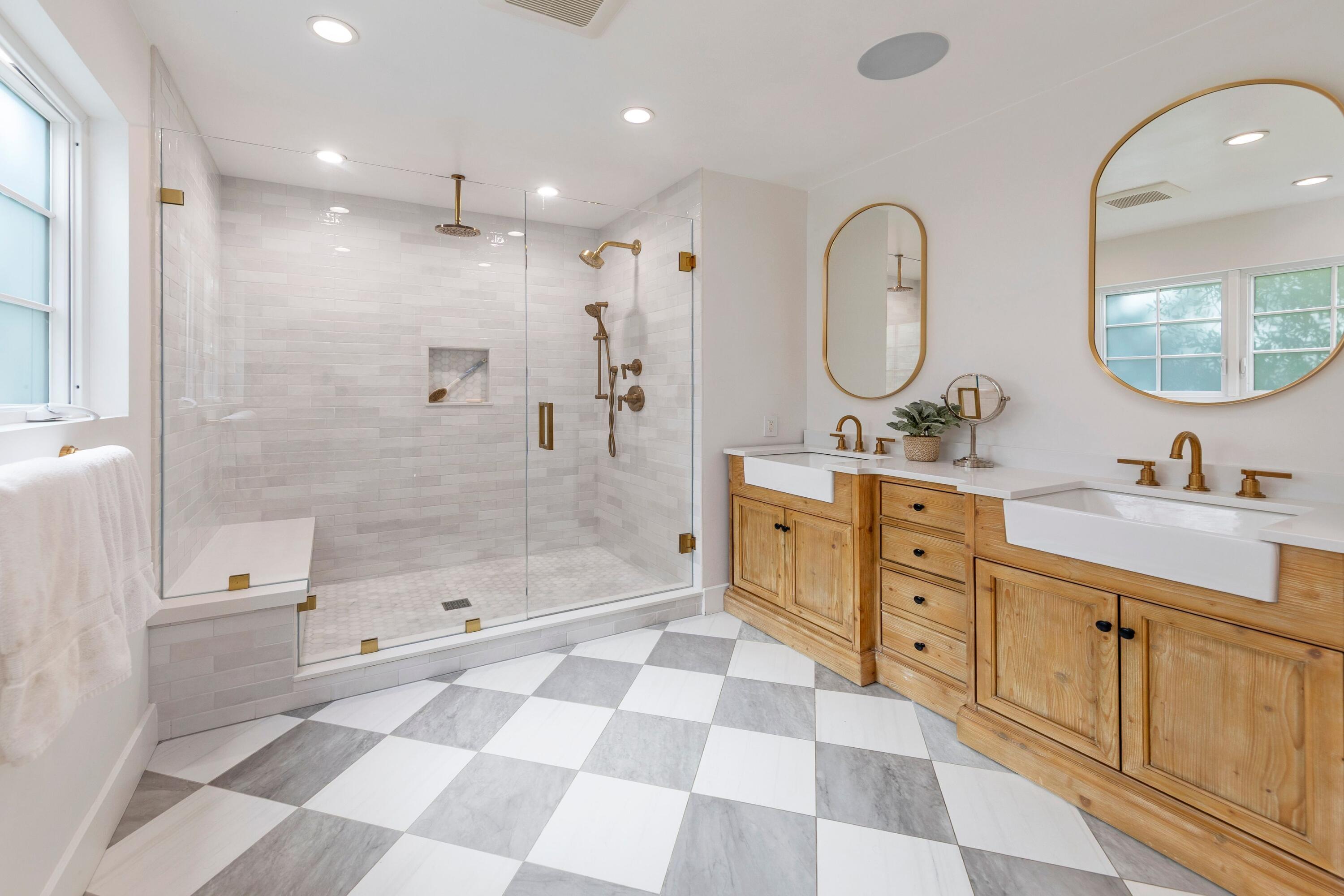 487 Hot Springs Road Santa Barbara, CA 93108 - Photo 11 of 47 a bathroom with a double vanity sink mirror toilet shower and bathtub