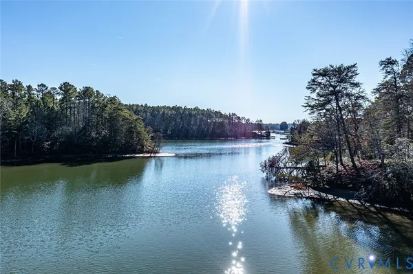 a view of a lake with houses in the back